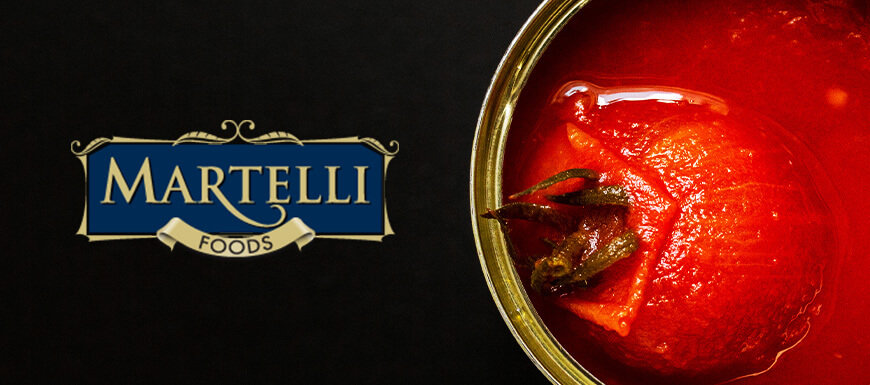 Close up of a san marzano tomato in can with Martelli logo beside